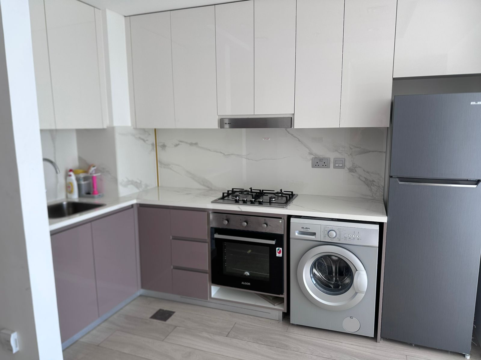 flowing into a sun-filled living room with large windows. A private balcony overlooking the pool adds a relaxing outdoor space.