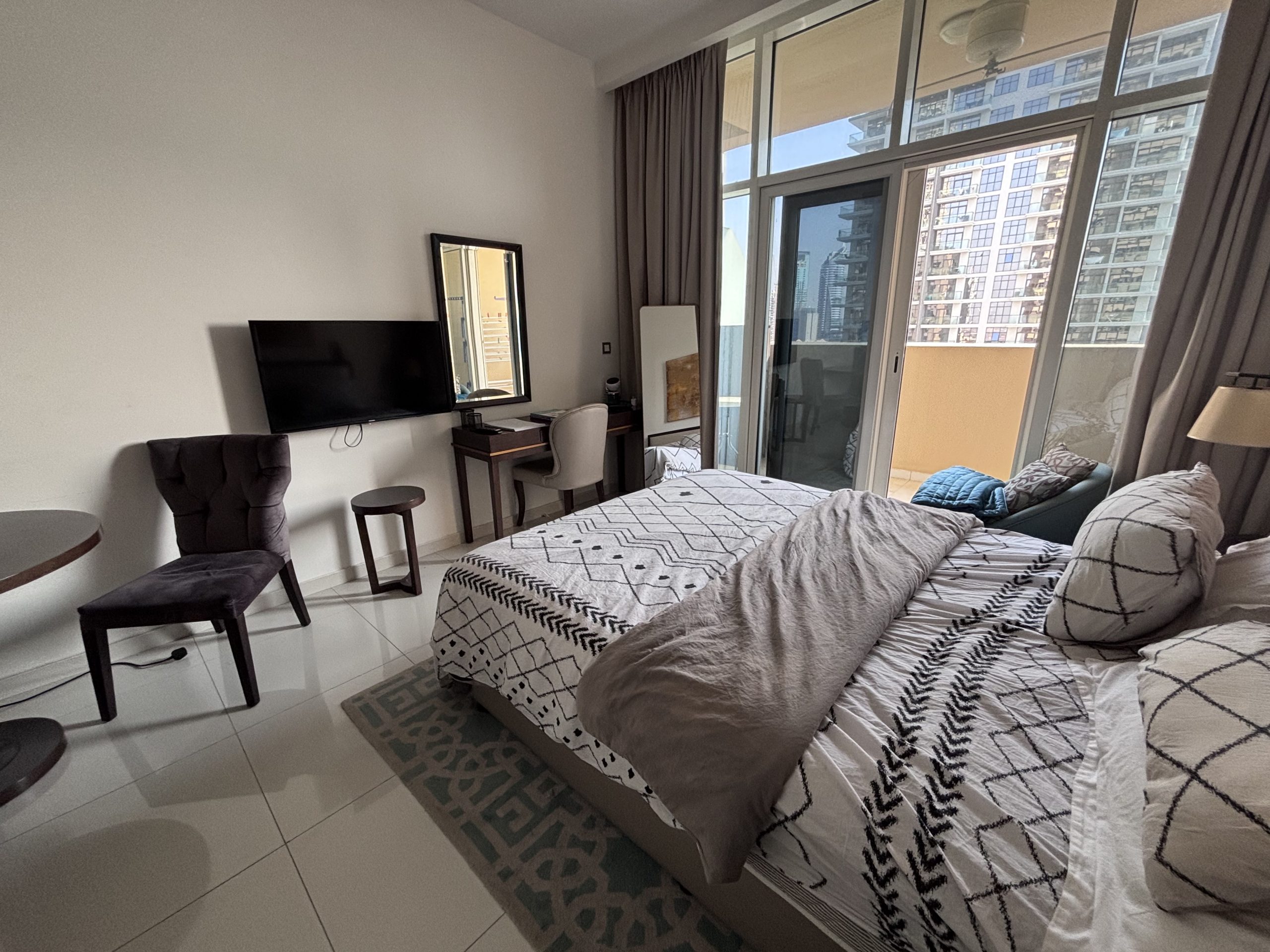 Jumeirah Village Circle. The unit is fully furnished and offers a pleasant pool view