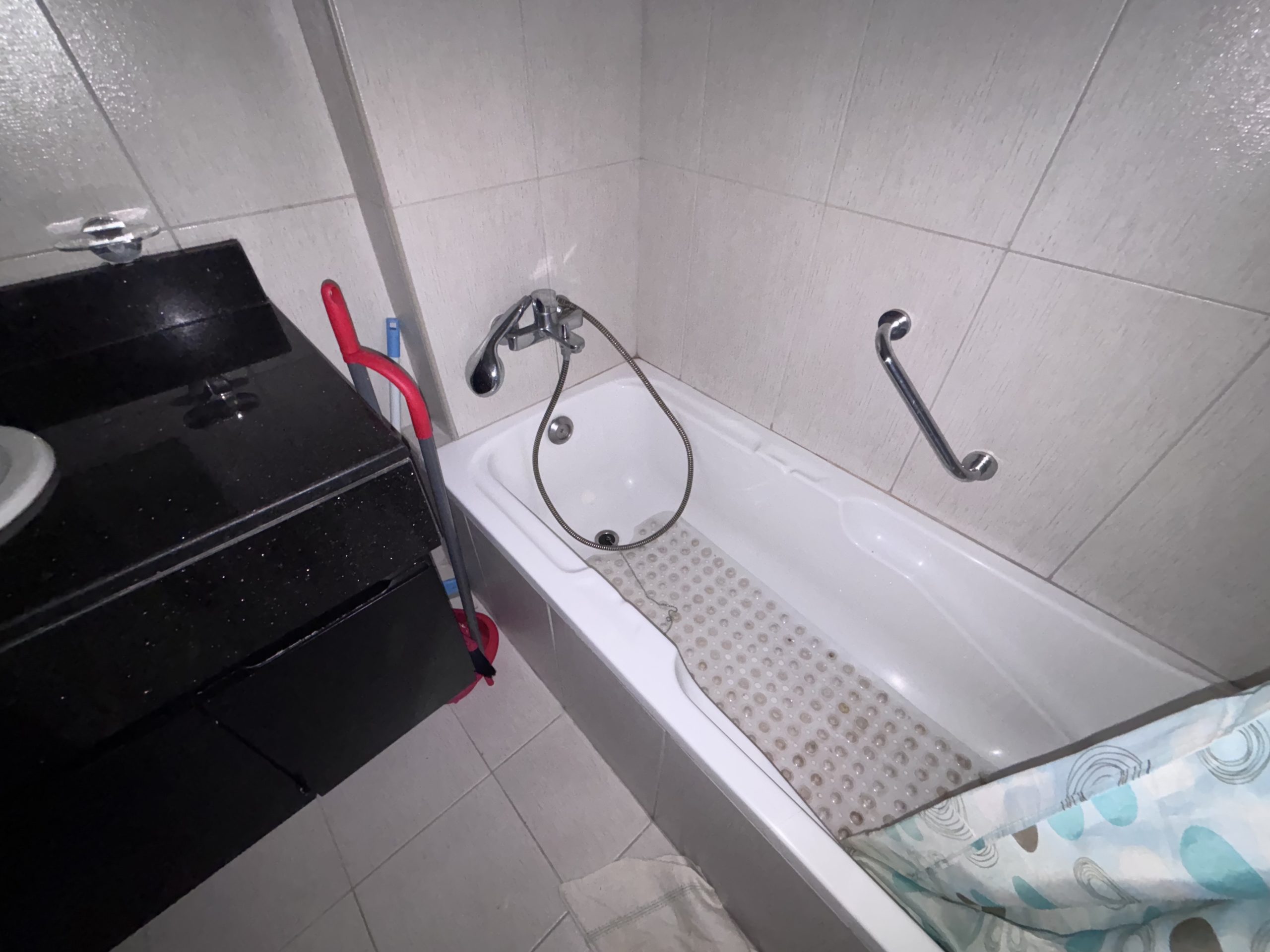 and a modern bathroom with a bathtub