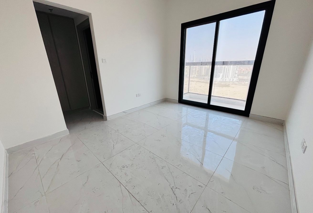 and an L-shaped balcony that connects both the living area and the bedroom. The bedroom includes built-in wardrobes and an en-suite bathroom with a walk-in shower. It also comes with one private covered parking space for your convenience.