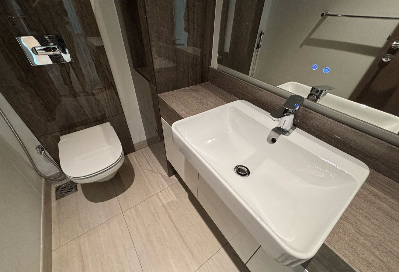 -Open Kitchen: Equipped with modern appliances and a breakfast bar