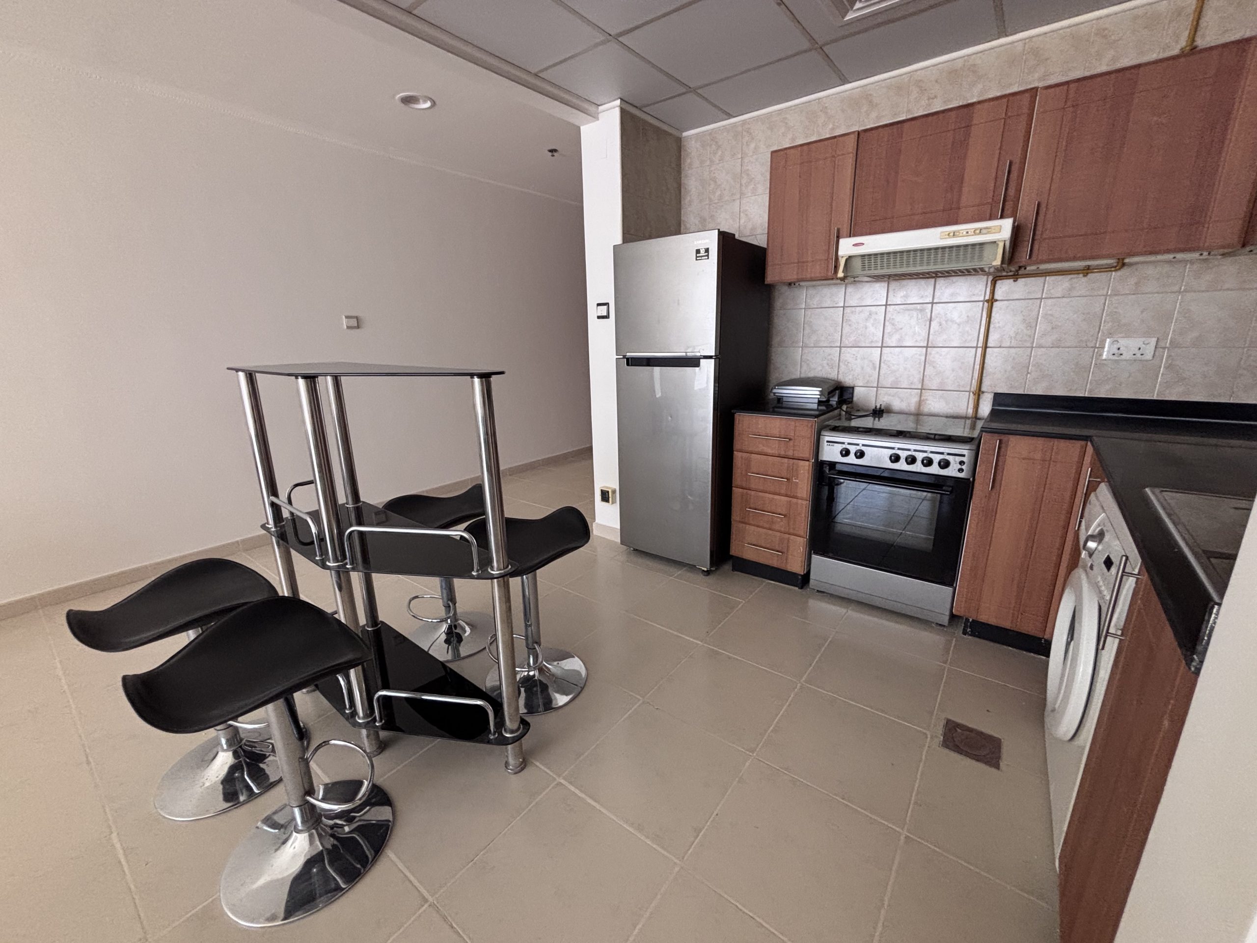 The apartment features a semi-open kitchen that connects seamlessly to a large