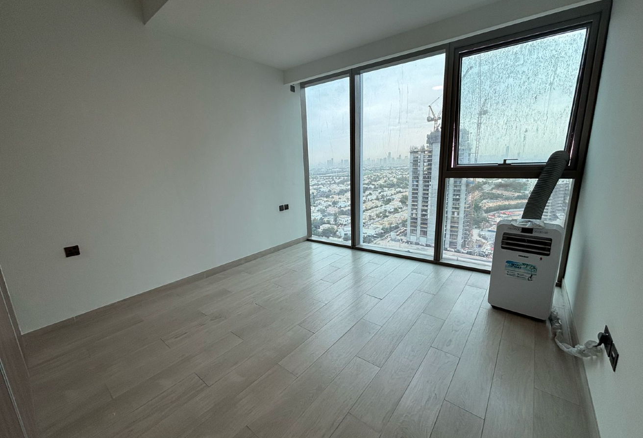 -Living Room: Spacious area leading to a private balcony